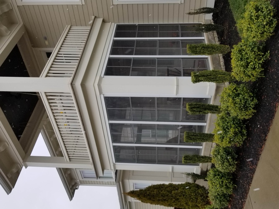 Home exterior with Eze-Breeze enclosed porch